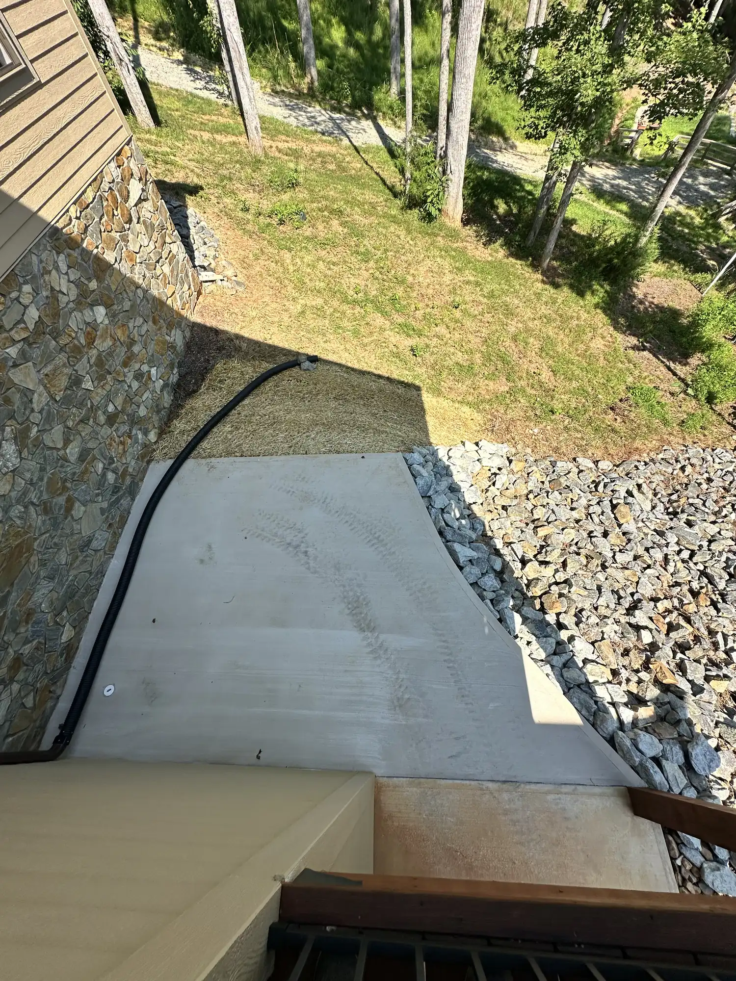 Concrete patio with stone borders and landscaping at Smith Mountain Lake