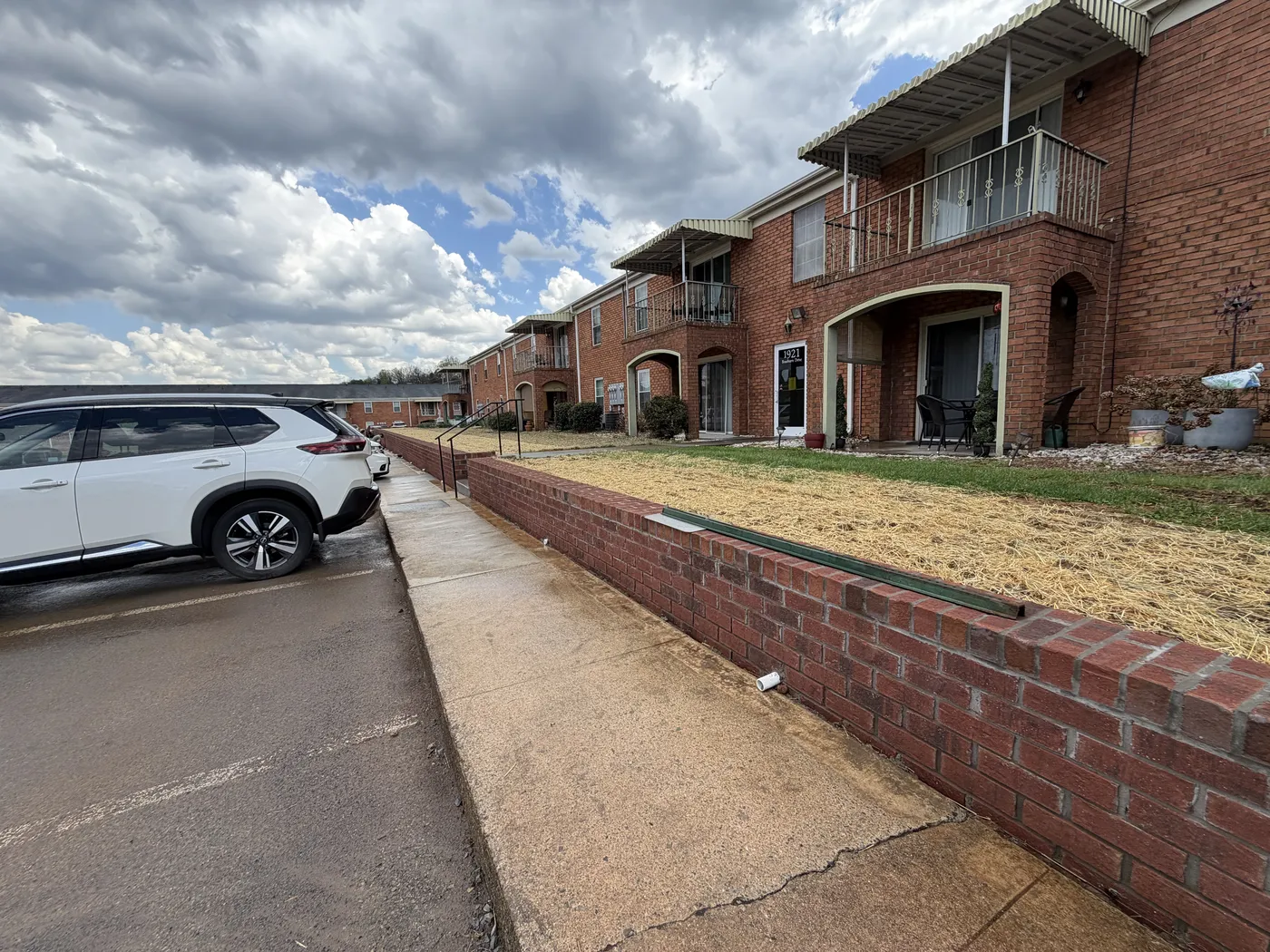 Completed retaining wall with sidewalk and straw erosion control