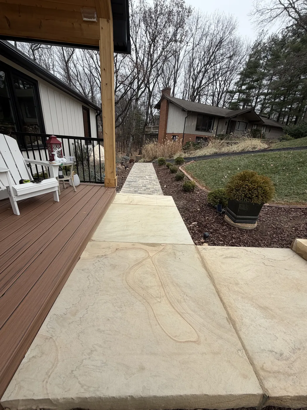 Close-up of concrete sidewalk and timber landscape edging at Hunting Hill