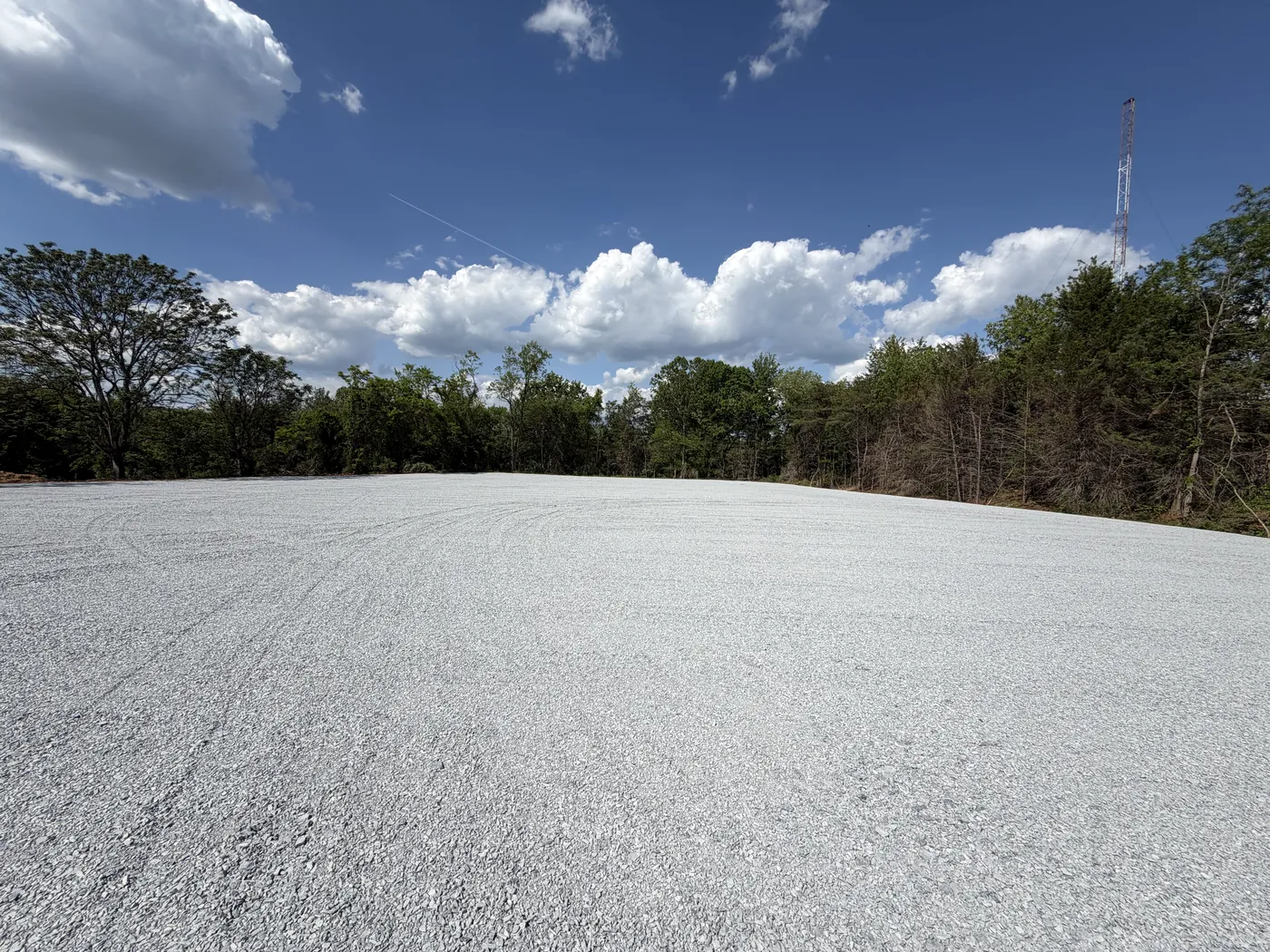 Wide angle of finished crushed stone lot for wrecker service